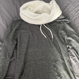 gray sweater, fur around the collar